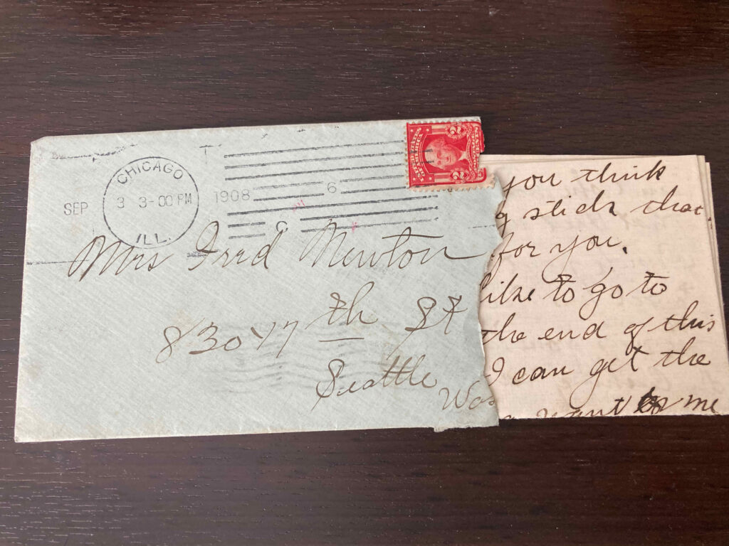 Plain envelope and portion of letter addressed to Mrs Fred Newton 830 17th St. Seattle Wa. Postmark Chicago, Ill., 3 September 1908 3pm.