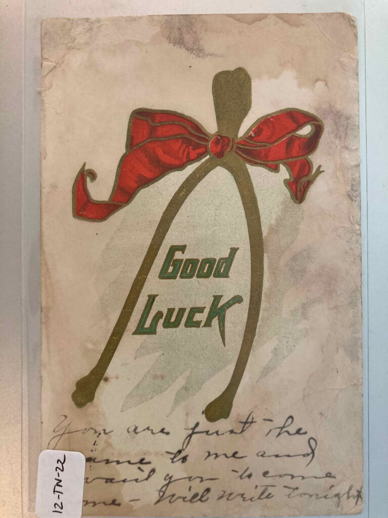 A wishbone with a ribbon and the message "good luck." Additional handwritten message as per post.